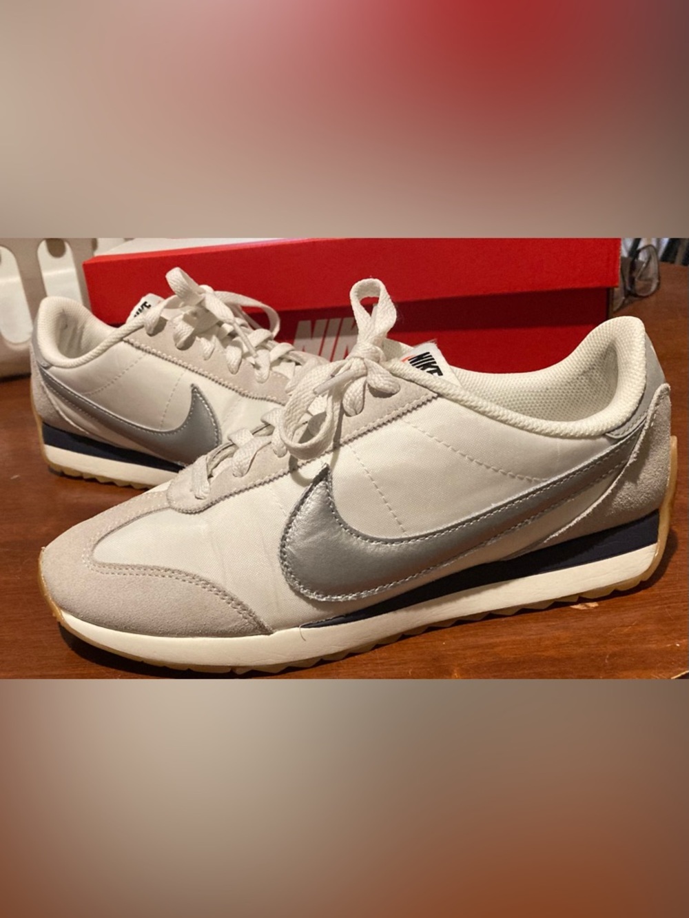 Nike women’s pacific Sneakers in sail/ metallic silver/ gridiron.